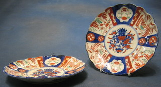 A pair of 19th Century Japanese Imari porcelain plates with lobed bodies, panel decoration 8"