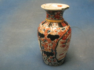 A 19th Century Japanese Imari porcelain vase of club form (chipped and f and r) 7 1/2"
