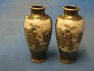 A handsome pair of 19th Century Japanese Satsuma porcelain vases with panel decoration depicting figures and mountain landscape, the base with seal mark 6 1/2"