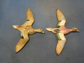 A  Sandbank pottery figure of a flying Widgeon (wing f and r) and a Sandbank figure of a Baldpate Drake