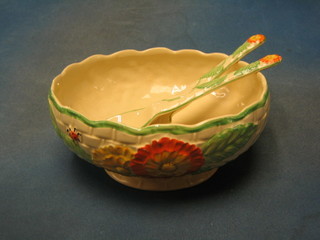 An Embassy ware Art Deco pottery salad bowl decorated flowers and ladybirds together with matching servers