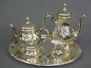 A 4 piece German silver glazed tea/coffee service with teapot, coffee pot, lidded sucrier and cover, cream jug and matching silver plated tray