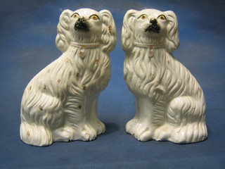 A pair of 19th Century Staffordshire figures of seated Spaniels 10" (chip to foot)