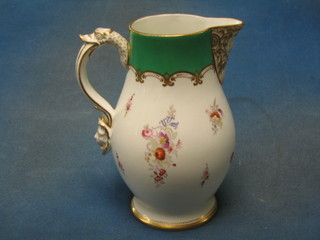 A 19th Century Continental porcelain jug with sparrow beak green and gilt banding with floral decoration 8"