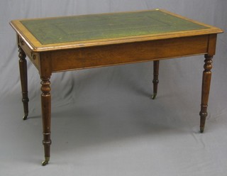 A 19th Century oak library table with inset tooled green leather top, fitted 2 long drawers and raised on turned supports 48"