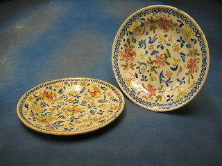 A pair of Persian style pottery plates with floral decoration 13" (1 f and r)