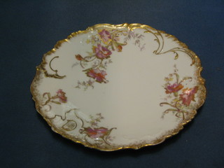 A Limoges 7 piece dessert service with leaf shaped serving dish (cracked) and 6 plates (1 chipped and 1 cracked)