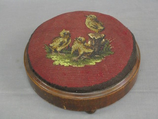 A circular Victorian mahogany stool with bead work top decorated birds 12"