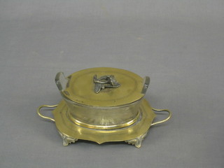 A cut glass oval twin handled butter dish, raised on a twin handled stand with lid