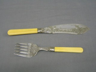 A pair of engraved silver plated fish servers