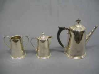 A  cylindrical 3 piece silver plated coffee service with coffee pot, twin handled sugar bowl and cream jug (pot handle f)