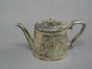 An oval engraved Britannia metal teapot
