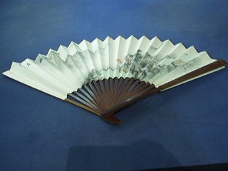 An Oriental painted hardwood fan