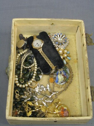 A collection of costume jewellery and a ladies gold cased wristwatch