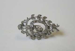A lady's attractive brooch set white stones