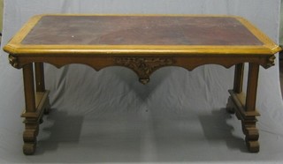 A Victorian honey oak library table of lozenge form, with inset tooled brown leather writing surface, raised on standard end supports (some carving missing) 62"