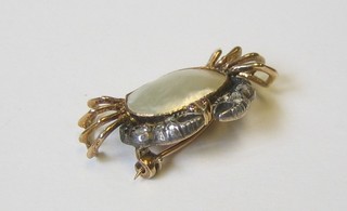A lady's gold bar brooch in the form of a crab set pearls and diamonds