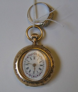 A lady's gilt cased fob watch and a gold dress ring set numerous diamonds