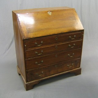 A Georgian mahogany bureau, the crossbanded fall revealing a well fitted interior above 4 crossbanded drawers with brass swan neck drop handles, raised on bracket feet 36"