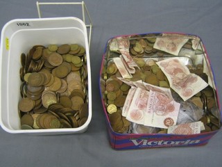 6 10 shilling notes and a quantity of old coins in a biscuit tin and and ice cream container