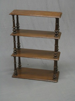 A range of 3 mahogany hanging wall shelves with turned columns to the sides 24"