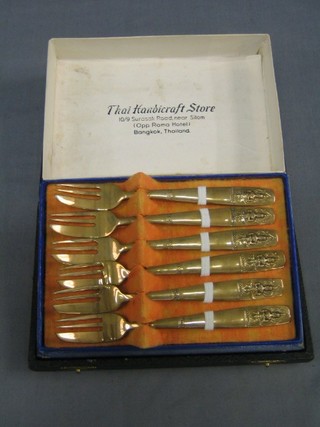 A set of 6 Taiwanese gilt metal pastry forks and 6 silver plated bean end coffee spoons 