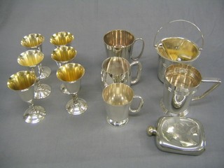 A silver plated ice pail and tongs, 6 silver plated goblets, a miniature folding cup, 4 silver plated tankards, a Britannia metal hip flask, a small silver backed brush and a pair of sugar tongs