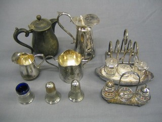2 silver plated hotwater jugs, do. twin handled sugar bowl and cream jug, toast rack and 3 condiment sets