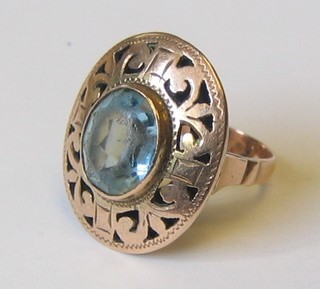 A lady's 14ct gold ring set an oval cut blue stone