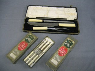 A 3 piece carving set and 12  table knives