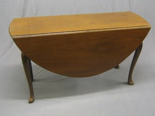 A 19th Century walnut oval drop flap gateleg dining table raised on carved cabriole supports 52"