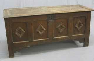 A 17th/18th Century oak coffer of panel construction with hinged lid and iron handle, 61"
