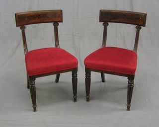 A set of 6 William IV mahogany bar back dining chairs with upholstered seats, raised on turned and reeded supports