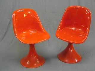 A pair of 1960's orange plastic Designer chairs (1 base slightly f)
