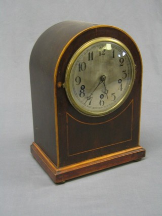 An Edwardian 8 day chiming bracket clock with silvered dial and Arabic numerals contained in an arch shaped inlaid mahogany case
