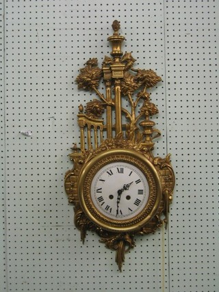 A reproduction Spanish made Cartel clock with painted dial and Roman numerals contained in a gilt metal case