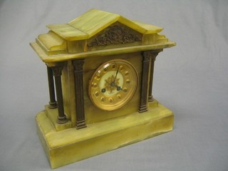 A Victorian 8 day striking mantel clock with gilt dial Roman numerals contained in a green onyx architectural case