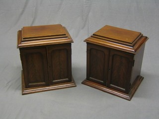 A pair of Victorian mahogany table top collector's cabinet with caddy tops enclosed by panelled doors 16" (interiors missing)