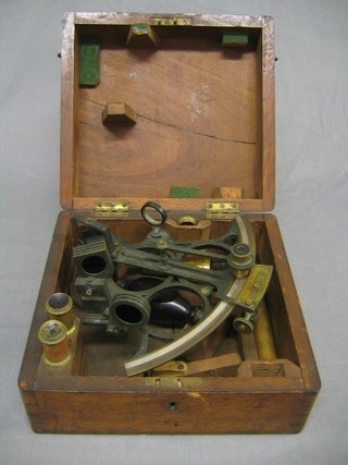 A 19th Century verdigris steel and brass sextant together with 3 lenses contained in a mahogany carrying case