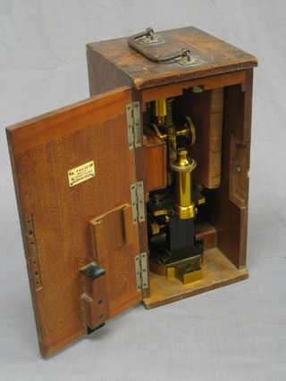 A 19th Century brass single pillar microscope by Creicheit VIII Benning Asse 26 Wine, number 6987, contained in original carrying case with 6 additional lenses etc,  together with 1 vol. of Dr Lankster "Half an Hour with the Microscope"