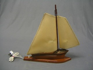 An Art Deco wooden table lamp in the form of a yacht 16 1/2" 