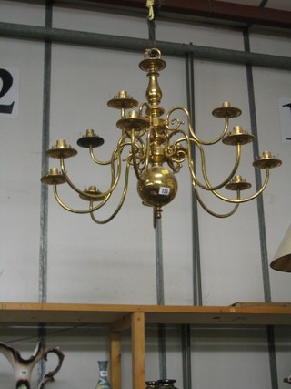 A Dutch style brass 12 light electrolier