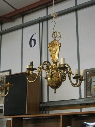 An impressive gilt metal 6 light electrolier with  rams head decoration