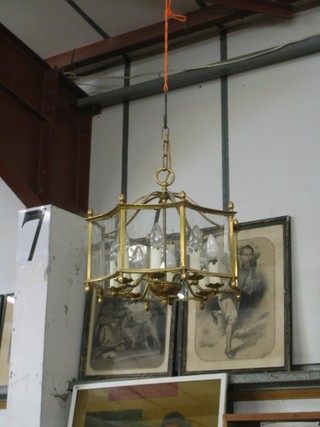 A Georgian style gilt metal 8 light electrolier contained in an octagonal gilt metal and glass frame
