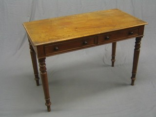 A Victorian mahogany side table, fitted 2 frieze drawers and raised on turned supports, 43"