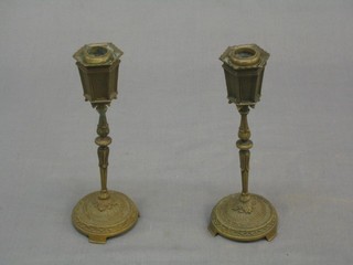 A pair of 19th/20th Century bronze candlesticks in the form of Continental street lamps 8 1/2"