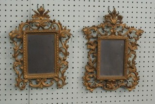 A pair of rectangular mirrors contained in a pierced gilt metal frame 12"