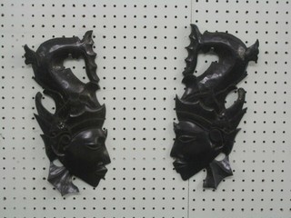 2 carved Eastern hardwood wall masks