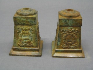 A pair of reproduction verdigris iron candle holders of square tapering form 6"