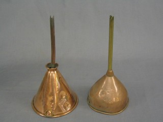 A pair of brass and copper beer funnels